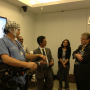 Prof. Contreras-Vidal explains to Rep. Culberson (right) how the brain-machine interface to the Rehab Rex exoskeleton works. 