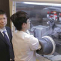 Yan Yao in his lab with a student researcher.
