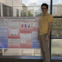 Agaoglu with his award-winning poster from the ARVO conference.
