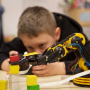Oliver, a fourth grader at UH Charter School, is keen on learning about robots
