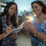A ray of hope: Stacey Louie, assistant professor of civil and environmental engineering, left, and Debora Rodrigues, associate professor of civil and environmental engineering, examining nanoparticles, to find new materials that will break down pollutants and work in sunlight