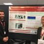 Musa Ozturk, a UH graduate student, stands in front of the award-winning poster with Jianping Wu, senior principal scientist at Medtronic and co-author of the study.