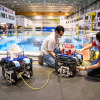 Associate Professor Aaron Becker and robotic swarm lab members Steban Soto and Javier Garcia conduct tests of a submersible ROV pairing at the Neutral Buoyancy Lab in August. 