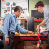 Manuel Cestari, Jose Contreras-Vidal and David Eguren work on the construction of a pediatric exoskeleton for brain-computer interfaced mobility. 