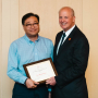Dr. Joseph W. Tedesco, Ph.D., P.E., the Elizabeth D. Rockwell Endowed Chair and Dean, presents the W.T. Kittinger Teaching Excellence Award to Jae-Hyun Ryou of Mechanical Engineering.