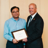 Dr. Joseph W. Tedesco, Ph.D., P.E., the Elizabeth D. Rockwell Endowed Chair and Dean, presents the W.T. Kittinger Teaching Excellence Award to Jae-Hyun Ryou of Mechanical Engineering.