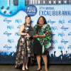 Inez Hutchinson [right], communications manager for the Communications Department of the Cullen College of Engineering, accepts one of the two gold Excalibur awards the department won from Felicia Perez, Houston chapter president of the Public Relations Society of America. 