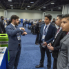 Santiago El Awad (left) speaking at the annual conference for the Dwight David Eisenhower Transportation Fellowship Program. El Awad has earned the fellowship three years in a row.