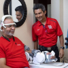 Passionate about brain waves, Jose Luis Contreras-Vidal, Hugh Roy and Lillie Cranz Cullen Distinguished Professor of electrical and computer engineering, is an international pioneer in noninvasive brain-machine interfaces and robotic device inventions. Here he is working with a patient testing the at-home equipment. 