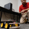 Once this tiny “smart car” is programmed with data, it can simulate several types of vehicles and point out weak points that could be susceptible to cyberattacks. It also can simulate communications between vehicles and the national Advanced Traffic Management System, then suggest to researchers where to look for potential trouble. Photo credit: Jon Burke