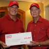 Dean Joseph Tedesco accepts a $25,000 check from Professor Larry Witte, chair of the UH Engineering Golf Committee. Photo by Tom Shea.