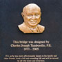 The plaque honoring Cullen College Alumnus C.J. Tamborello at the pedestrian bridge crossing Sims Bayou in FM Law Park.