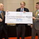Raymond Flumerfelt, director of the petroleum engineering program, is presented with a check from the college's Petroleum Engineering Advisory Board. Photo by Jeff Fantich.