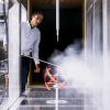 Daniel Araya, assistant professor of mechanical engineering, demonstrates how his wind tunnel can generate electricity. Photo courtesy of Michael Ciaglo, Houston Chronicle Staff