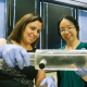 Debora Rodrigues, left, and Stacey Louie, both faculty members in the Cullen College of Engineering, are using a reactor built to simulate the intestines of a pig to study ways to combat antibiotic resistance.